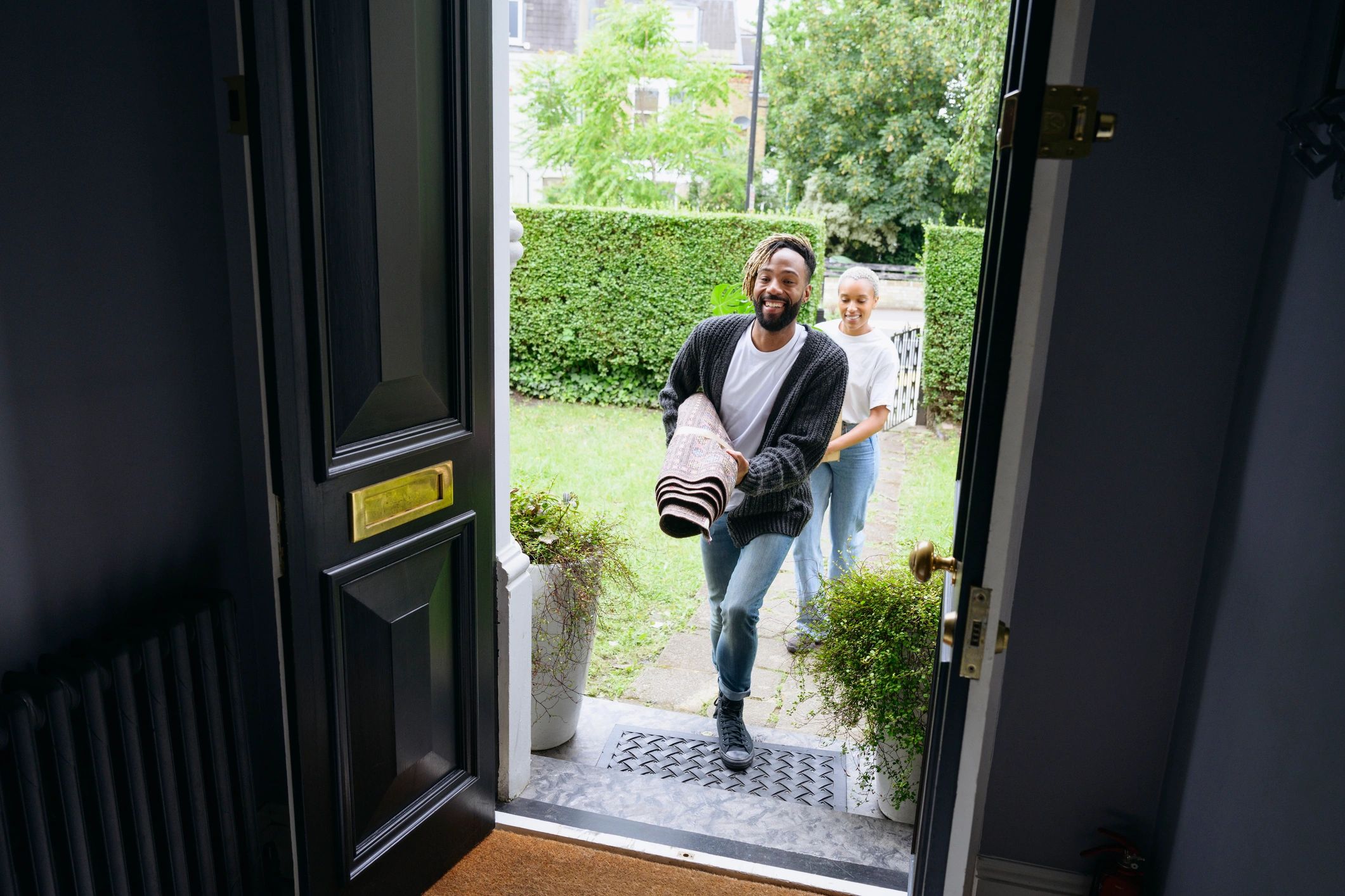 Homeowners at a front door