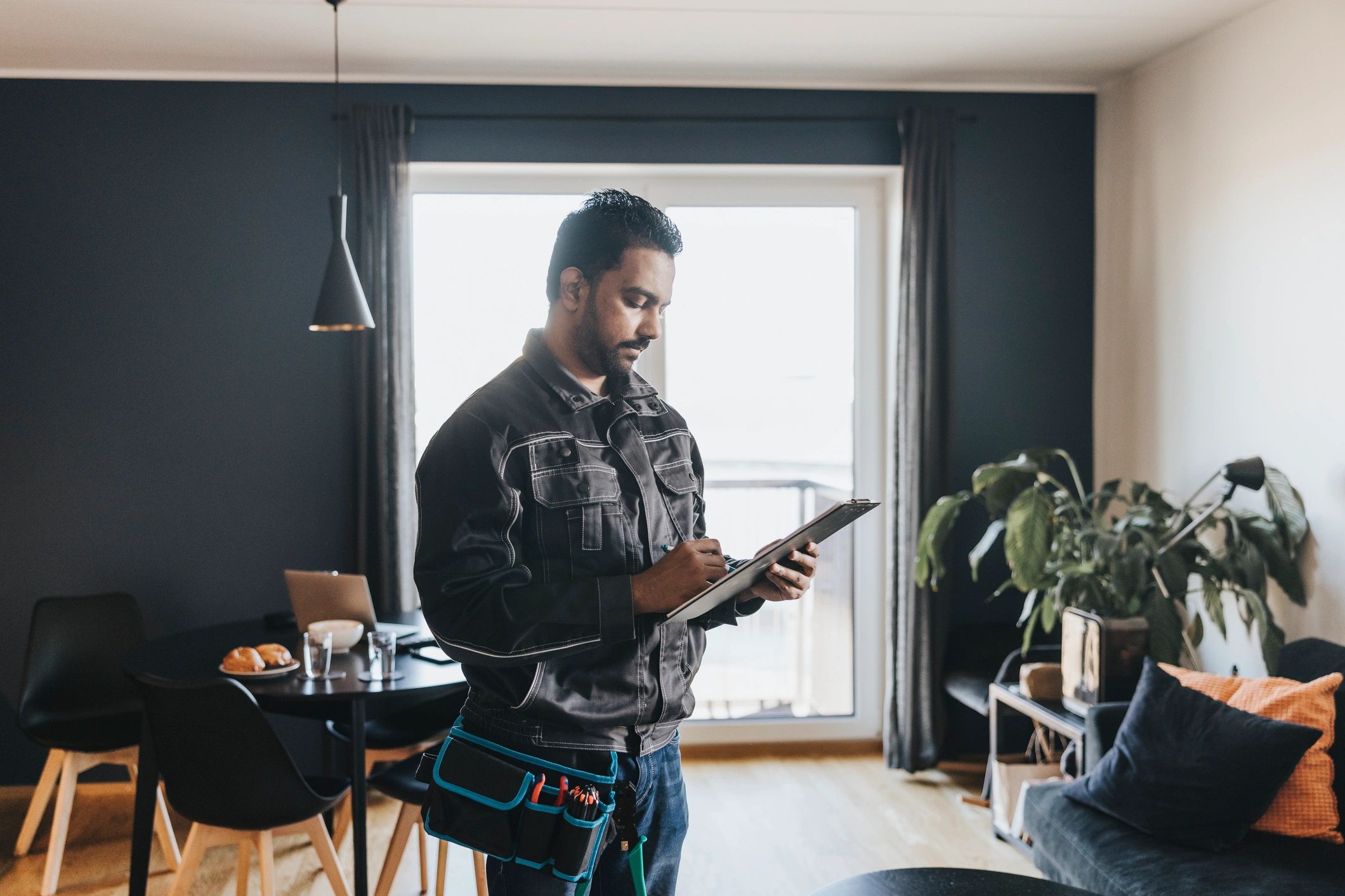 Pest control technician at a home, preparing to help a customer