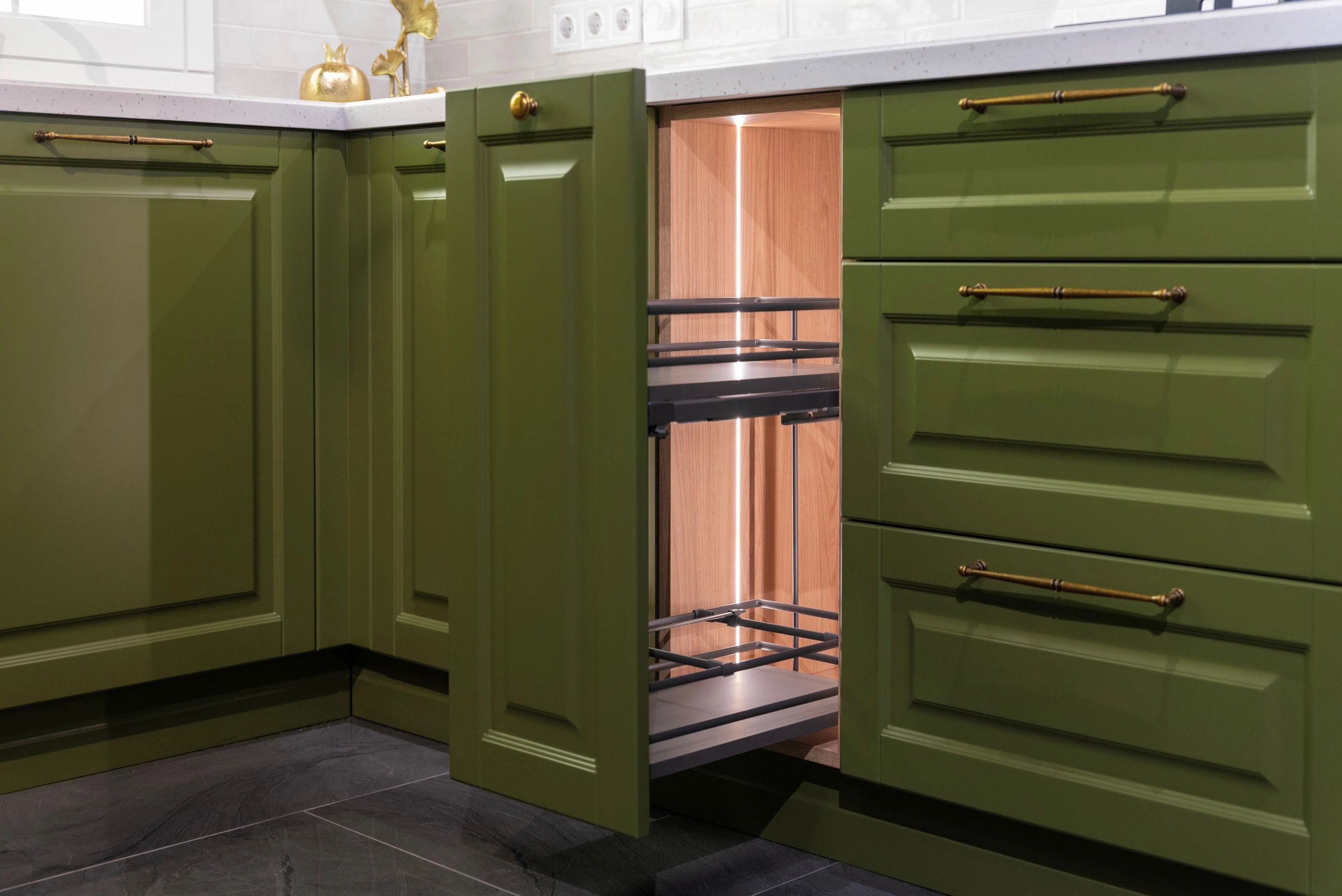 Open kitchen cabinet drawer showing storage area